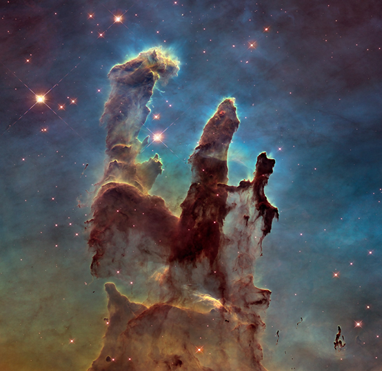 أعمدة الخلق. صورة التقطها تلسكوب هابل لمنطقة غنية بالغاز والغبار في سديم النسر