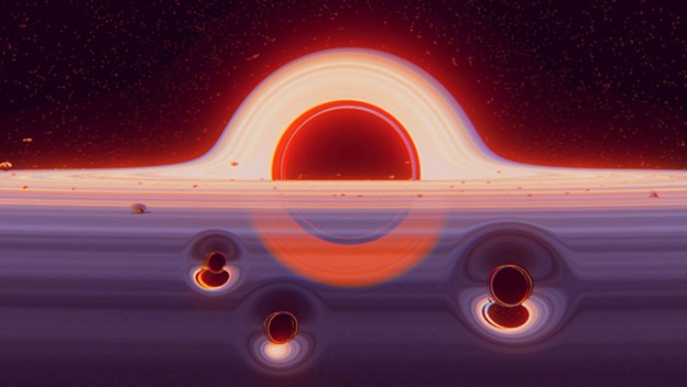 شكل فني يوضح ثقوب سوداء بحجم الشمس يغطيها ثقب أسود ضخم